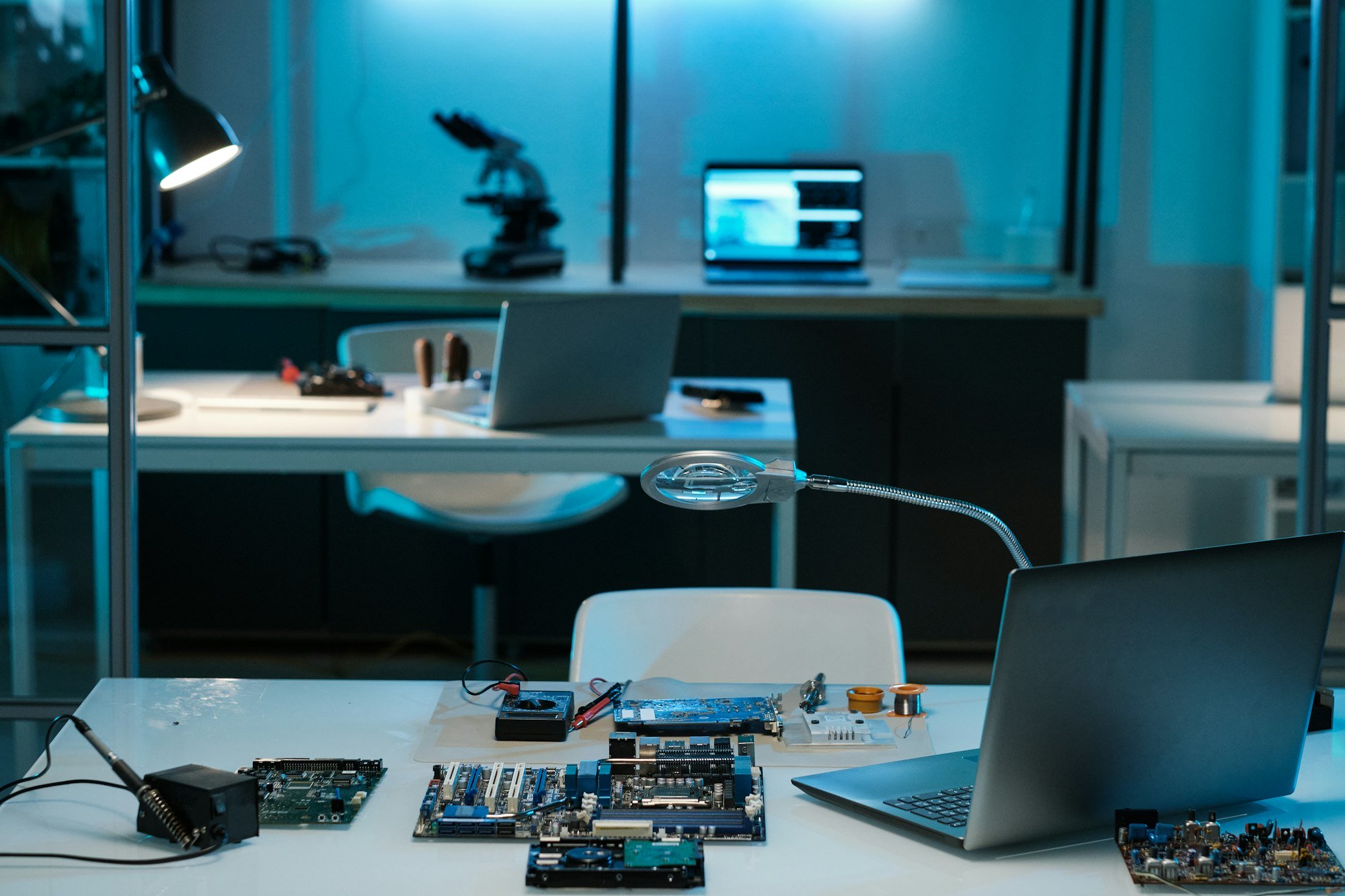 Workplace of repairman or technician with laptop and hardware Workplace of repairman or technician with laptop and hardware